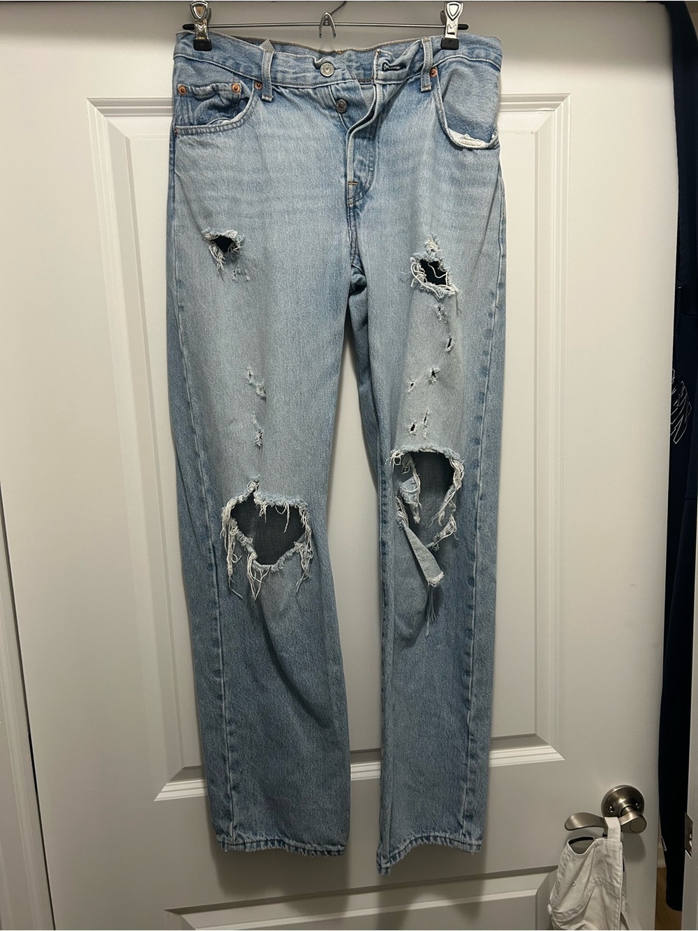 Levi’s light wash 501 distressed painter blue jeans